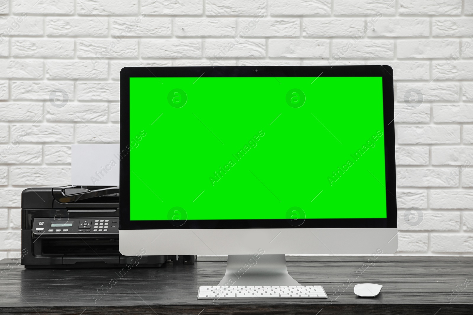 Image of Computer display with chroma key on desk in room. Comfortable workplace