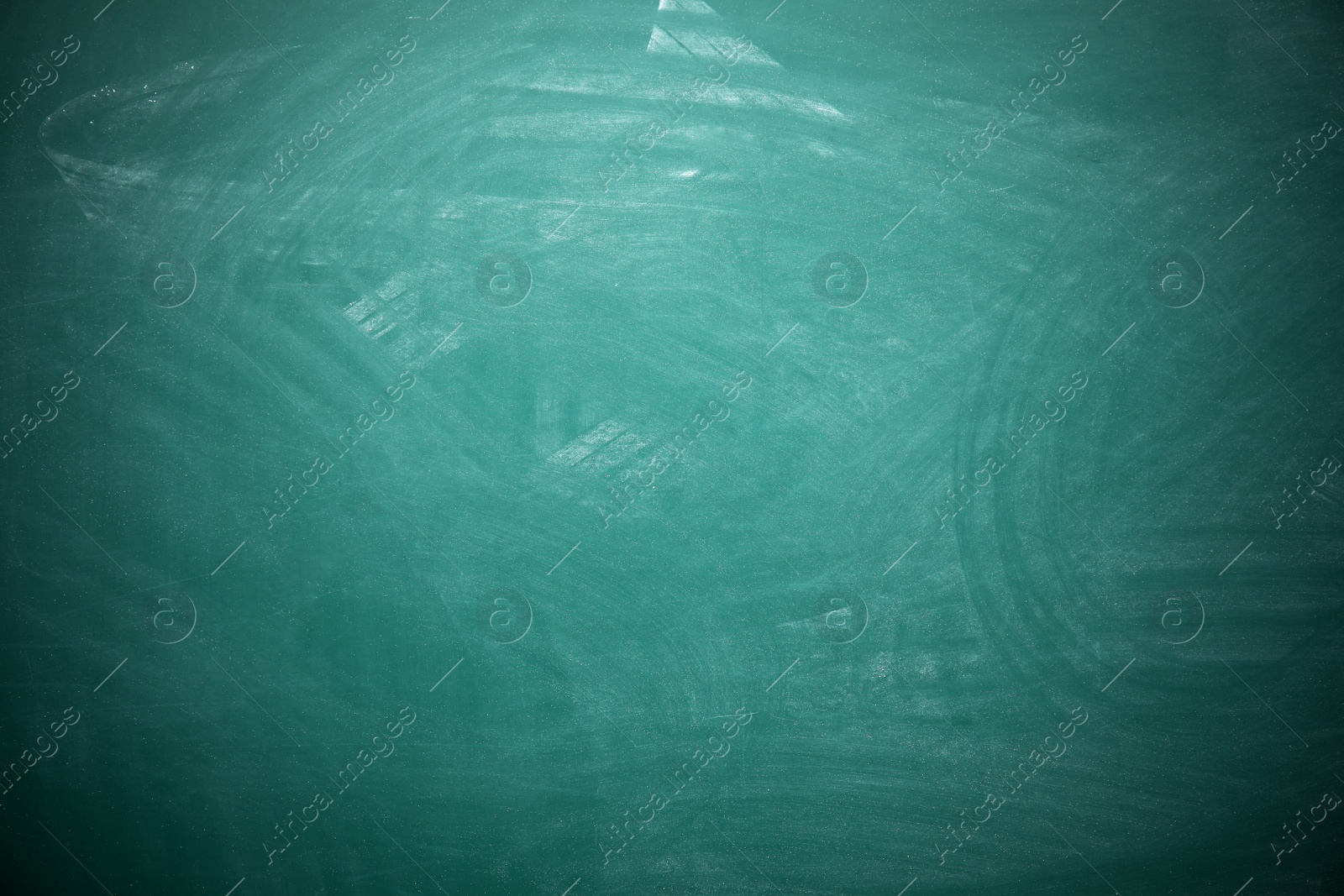 Photo of Dirty green chalkboard as background. Space for text