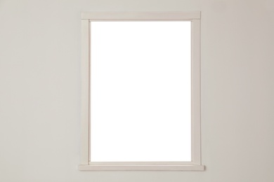 Photo of White wall with modern window indoors. Element of interior