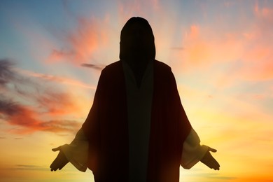 Image of Silhouette of Jesus Christ outdoors at sunset