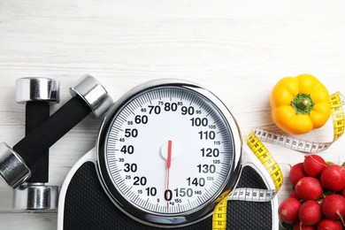 Photo of Flat lay composition with scales and healthy food on white wooden table, space for text