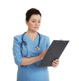 Portrait of female doctor in scrubs with clipboard isolated on white. Medical staff