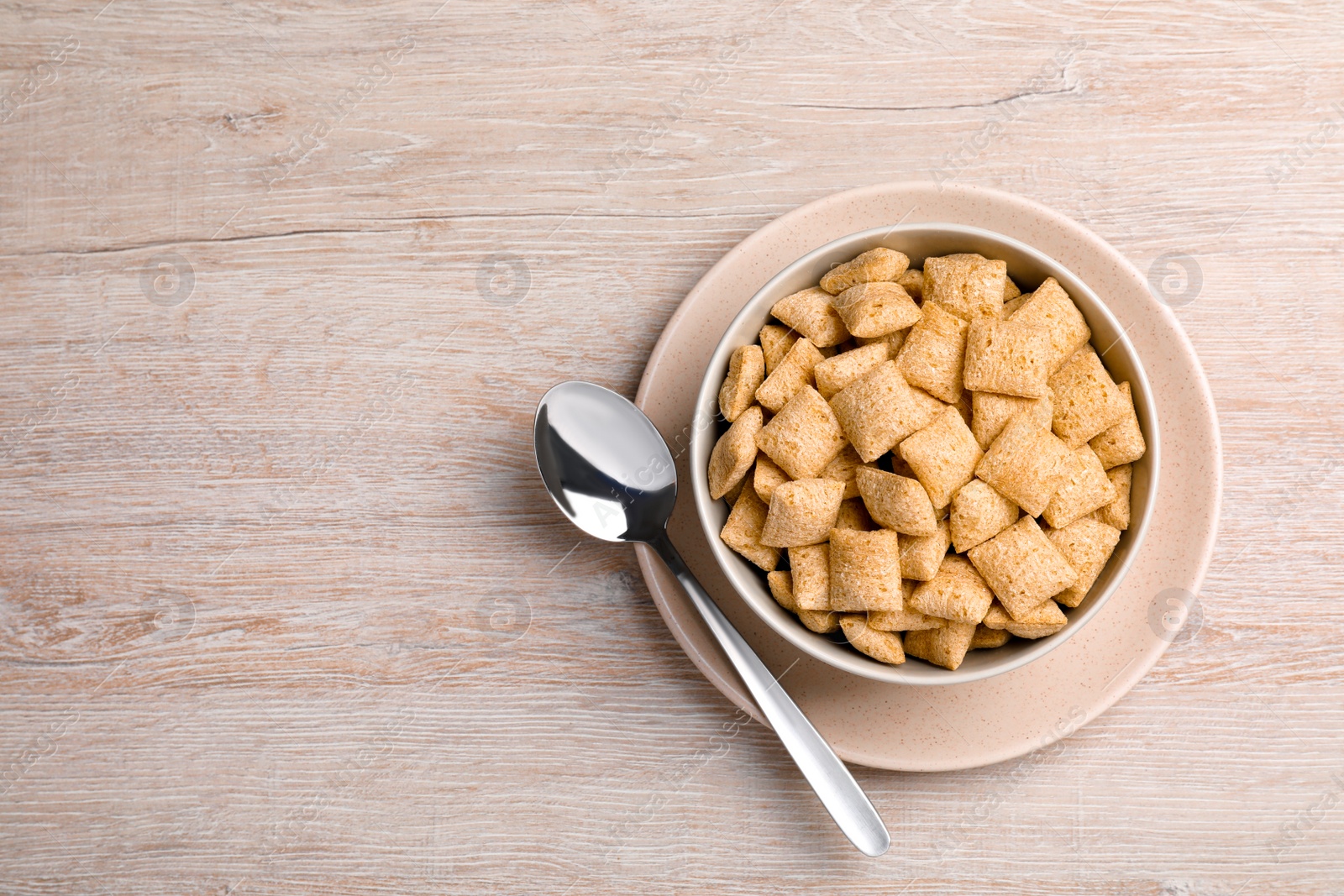 Photo of Delicious corn pads served on light wooden table, top view. Space for text