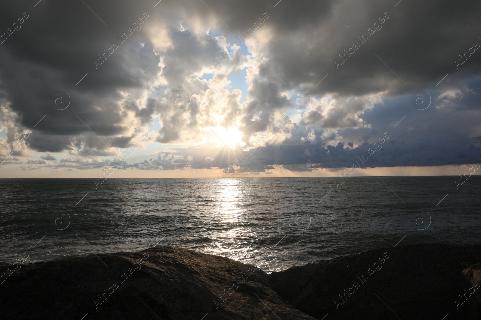 Photo of Picturesque view of sky with heavy rainy clouds over sea