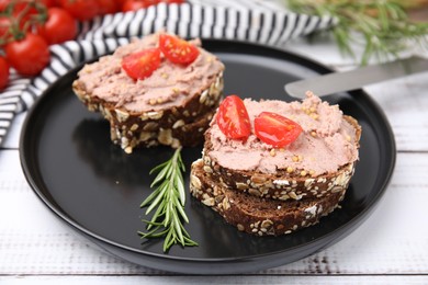 Delicious liverwurst sandwiches served on white wooden table, closeup