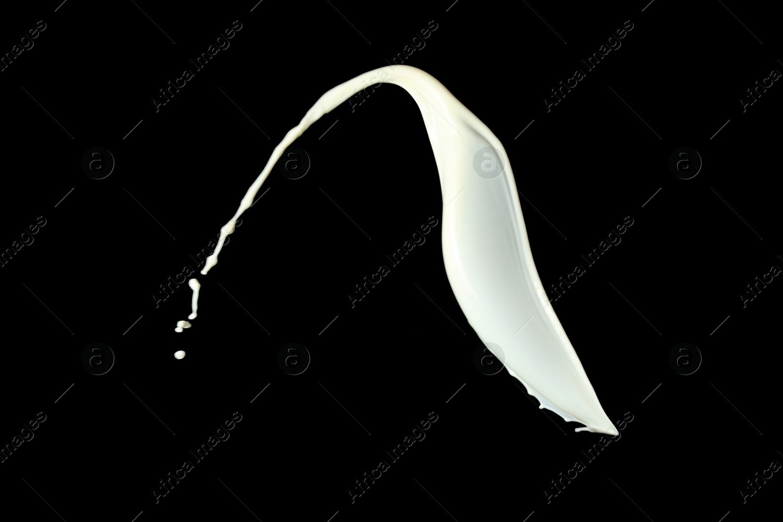 Photo of Splash of fresh milk on black background