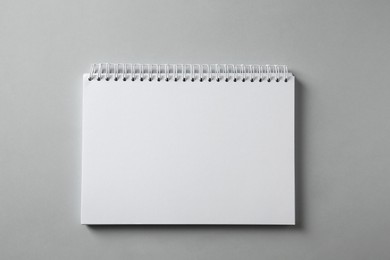 Photo of Blank notebook on grey background, top view. Mockup for design