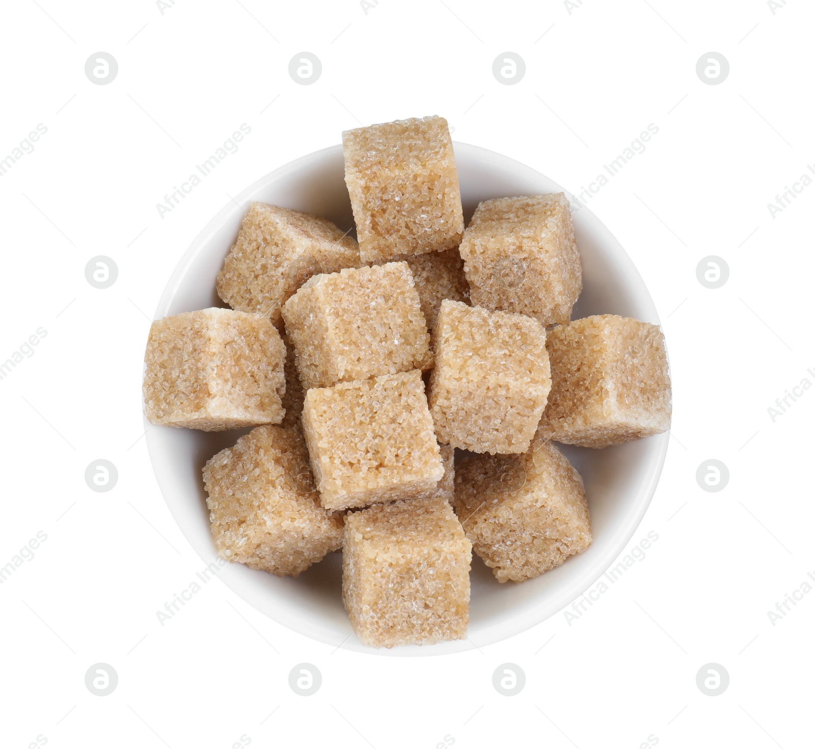 Photo of Brown sugar cubes in bowl isolated on white, top view