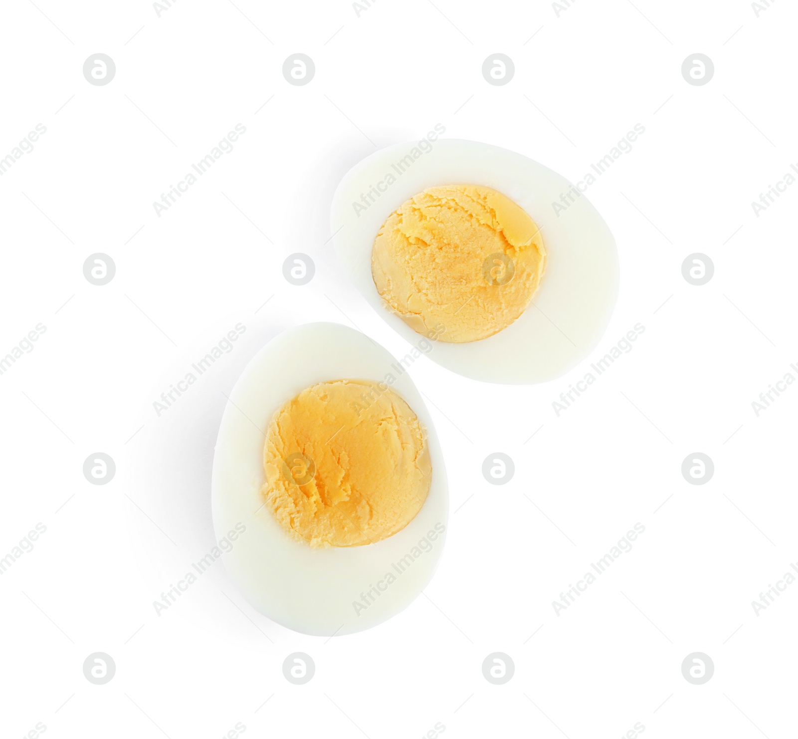 Photo of Halves of fresh hard boiled chicken egg isolated on white, top view