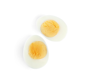 Photo of Halves of fresh hard boiled chicken egg isolated on white, top view