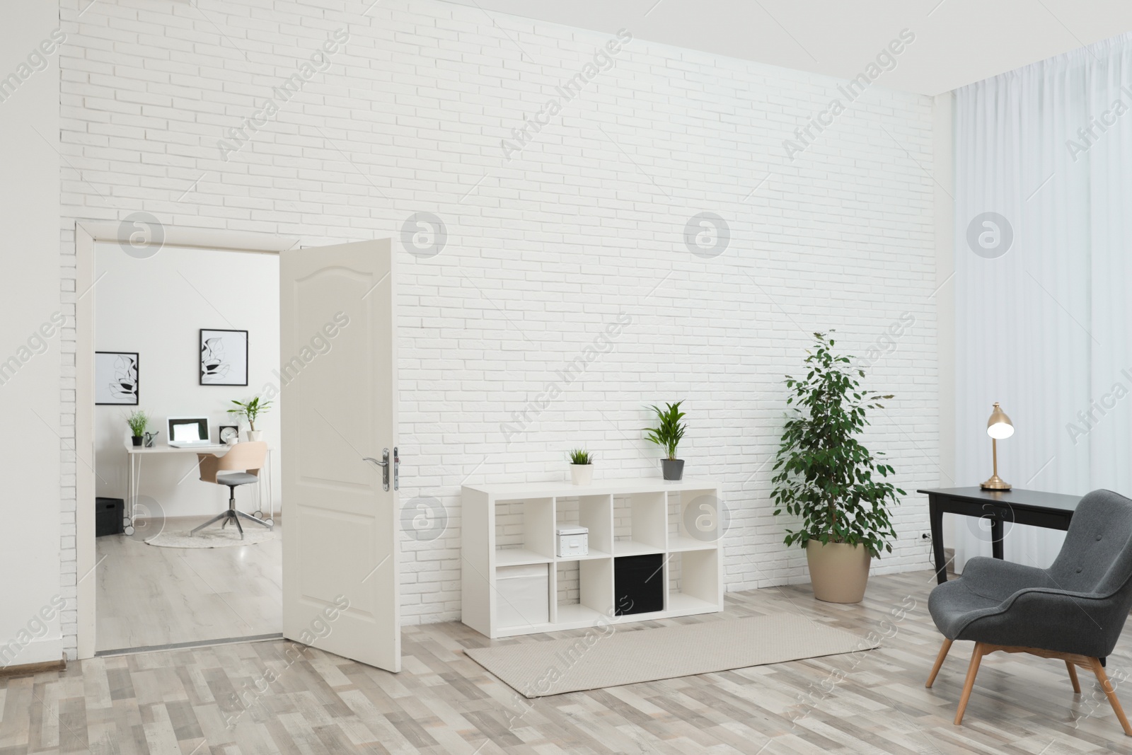 Photo of Living room interior with stylish furniture and open door