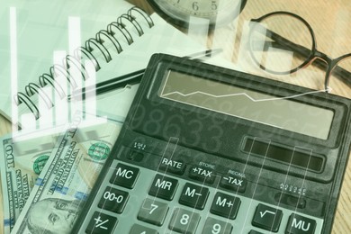 Image of Calculator, money and stationery on table, closeup