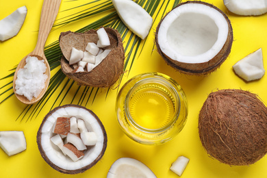 Photo of Flat lay composition with coconut oil on yellow background