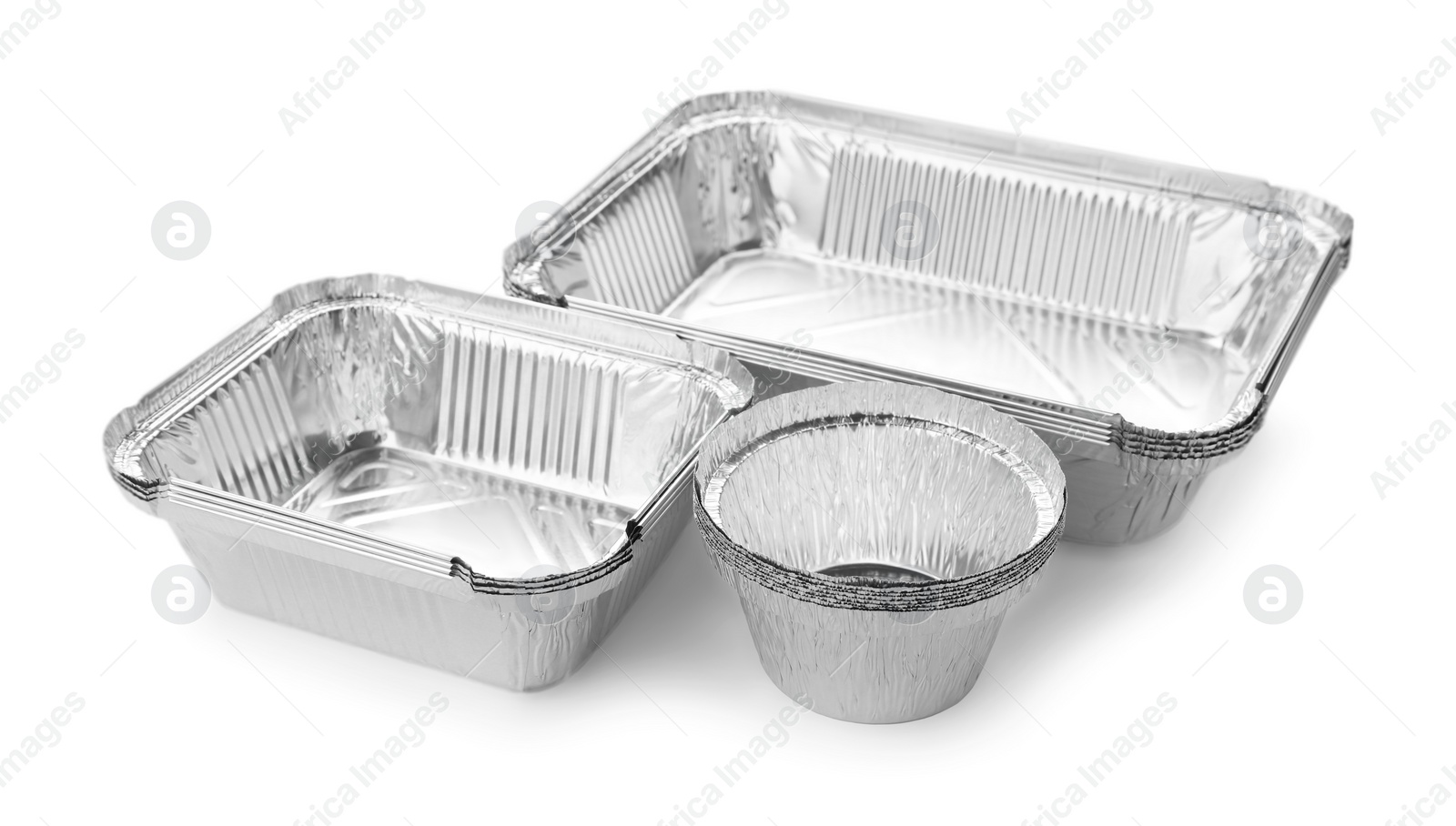 Photo of Many different aluminum foil containers isolated on white