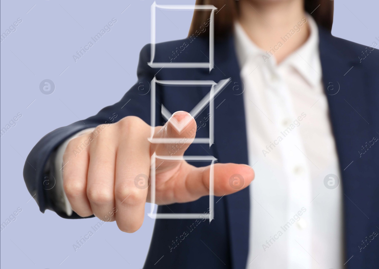 Image of Woman pointing at check mark in box on virtual screen, closeup