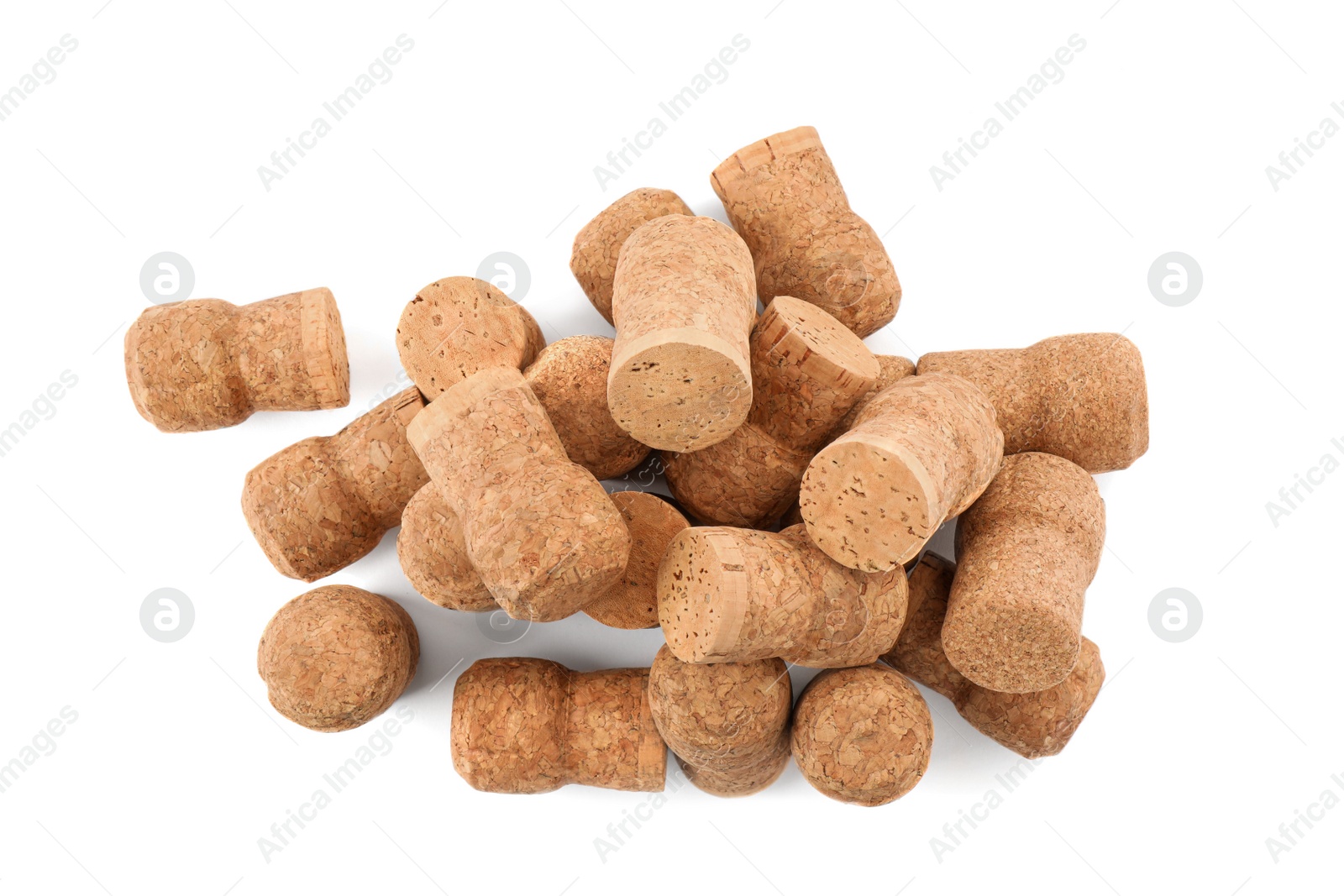 Photo of Heap of sparkling wine corks on white background, top view