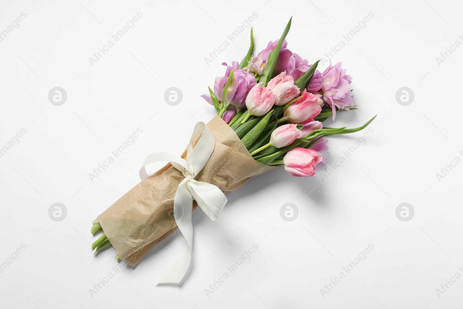 Photo of Beautiful bouquet of colorful tulip flowers on white background, top view