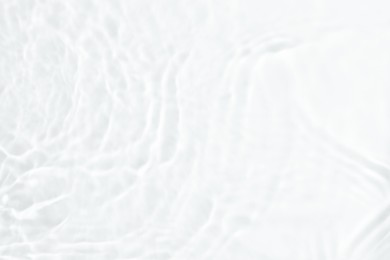 Image of Closeup view of water with ripples on white background