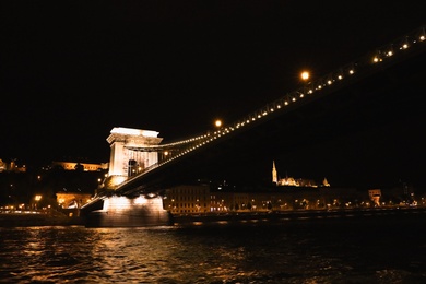 Photo of BUDAPEST, HUNGARY - APRIL 27, 2019: Beautiful night cityscape with illuminated Szechenyi Chain Bridge across Danube river