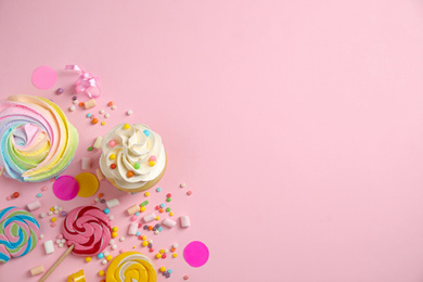 Photo of Flat lay composition with cupcake on pink background, space for text. Birthday party