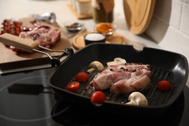 Photo of Frying pan with fresh raw meat and vegetables, closeup