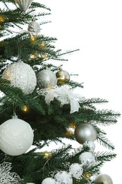 Photo of Christmas tree with beautiful decorations on white background, closeup