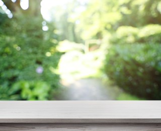 Image of Empty white wooden surface outdoors on sunny day. Space for design