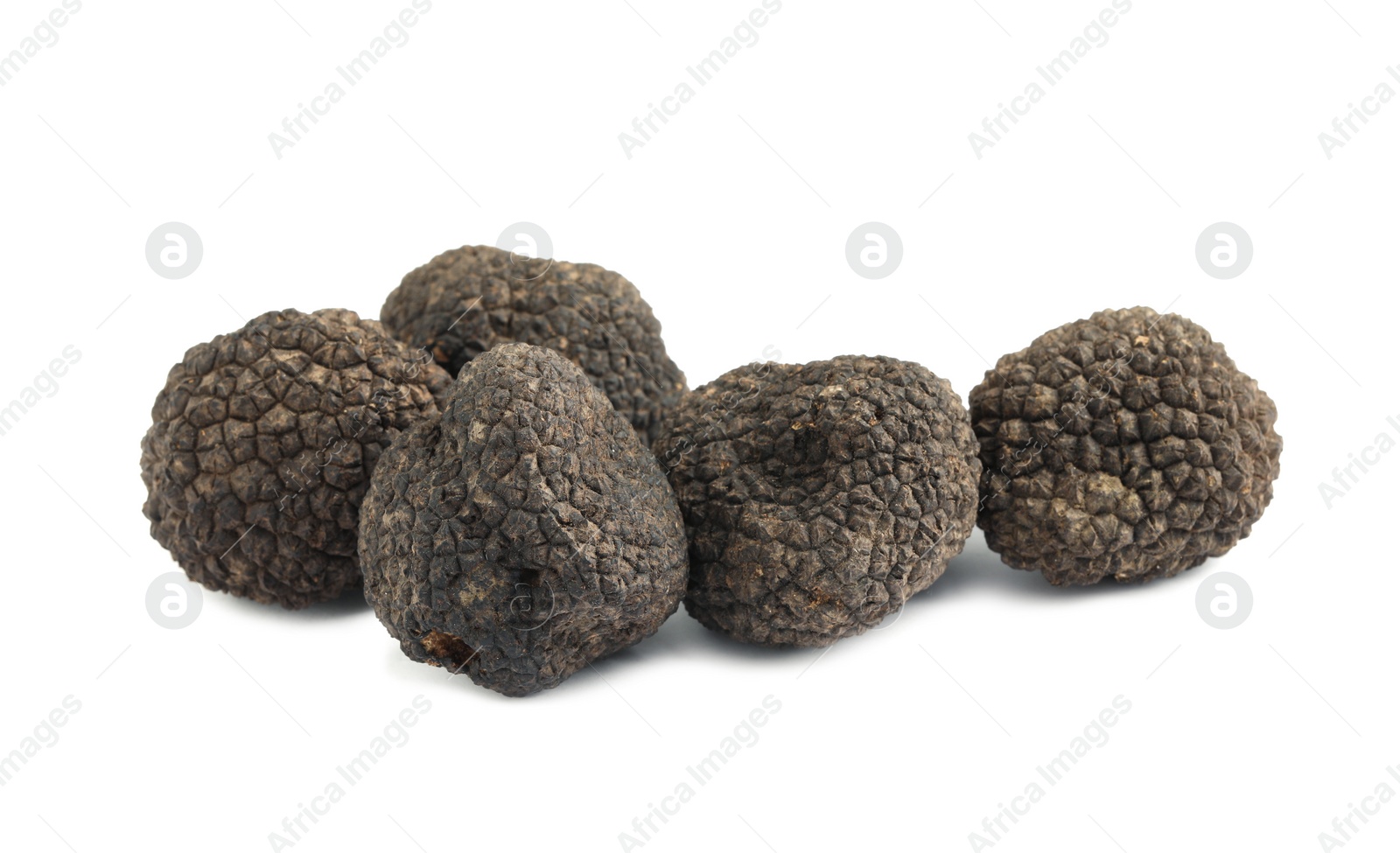 Photo of Fresh whole black truffles isolated on white