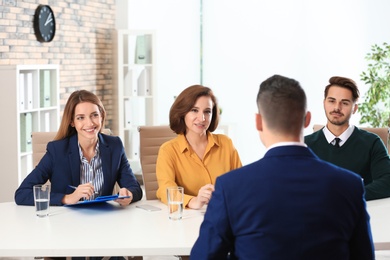 Human resources commission conducting job interview with applicant in office