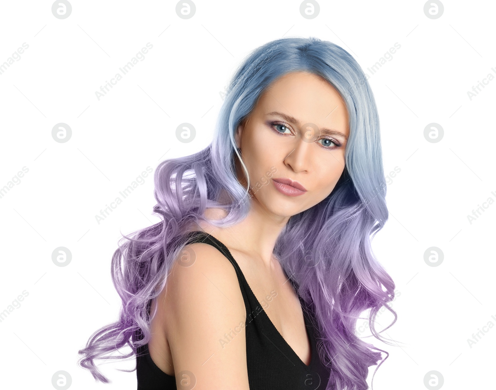 Image of Portrait of young woman with dyed long curly hair on white background