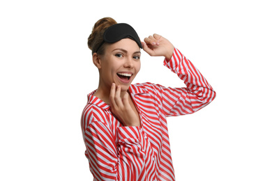 Photo of Beautiful woman wearing pajamas and sleeping mask on white background. Bedtime