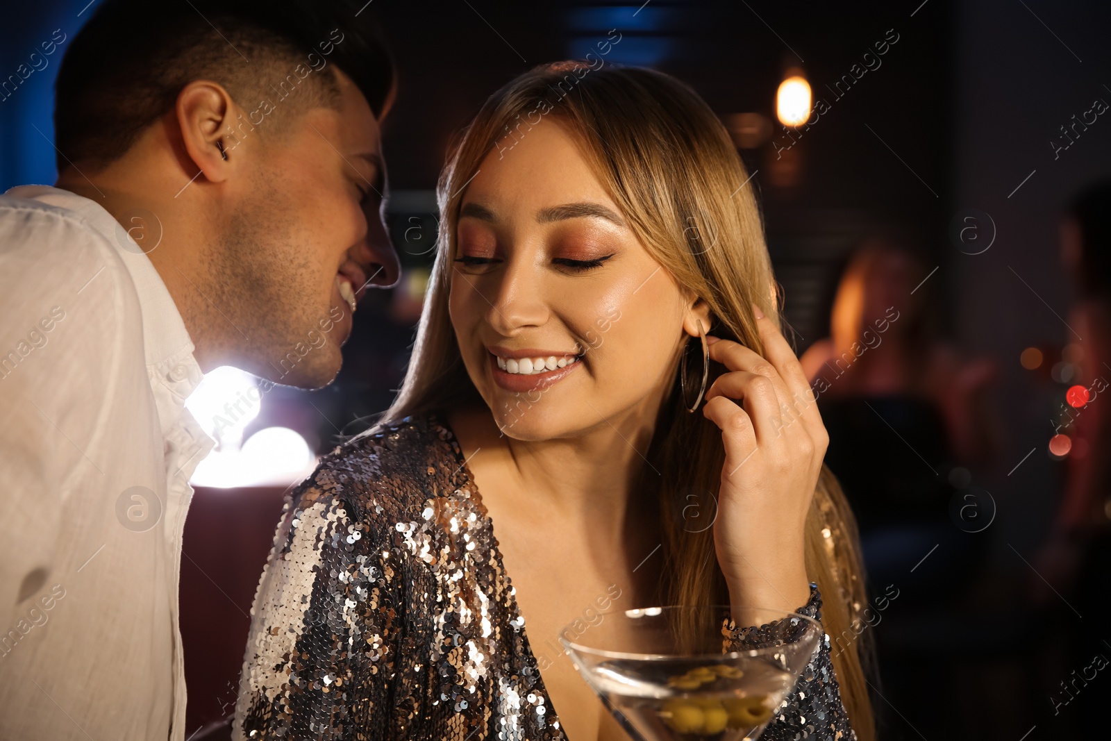 Photo of Man and woman flirting with each other in bar