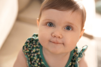 Photo of Portrait of cute little baby girl at home