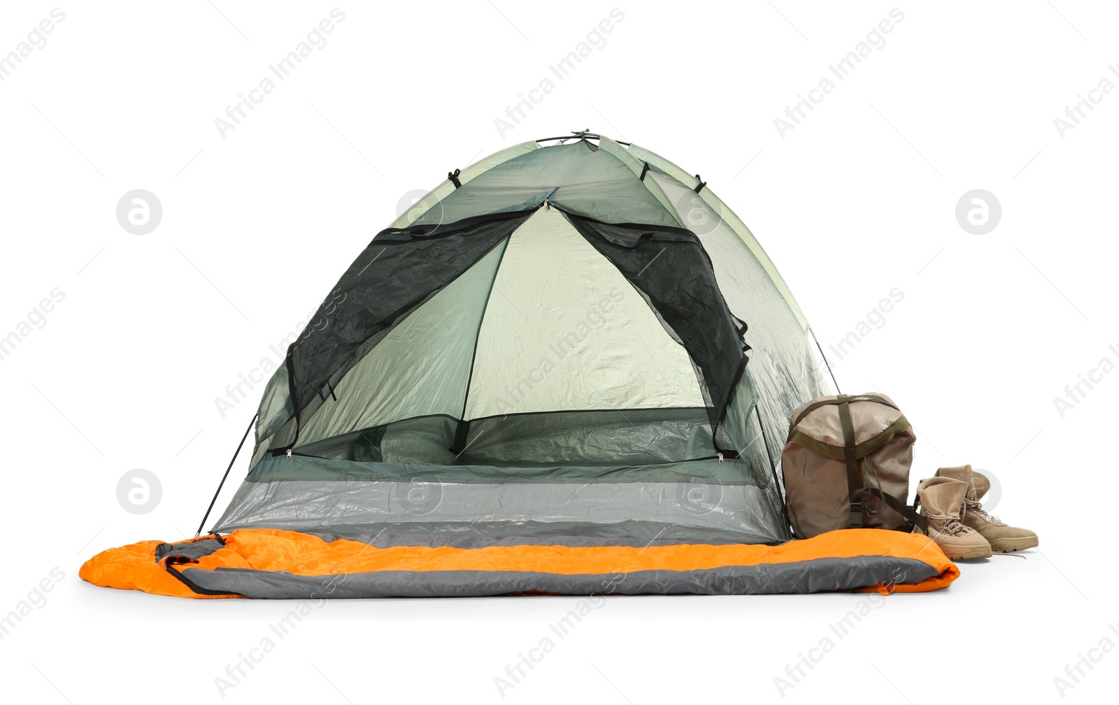 Photo of Comfortable grey camping tent with sleeping bag and boots on white background