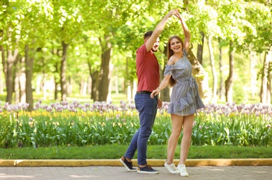 Photo of Happy young couple in green park on sunny spring day