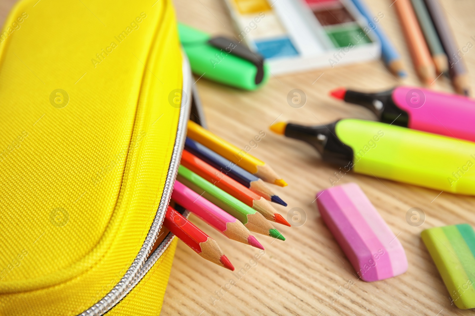 Photo of Different stationery on wooden table. Back to school