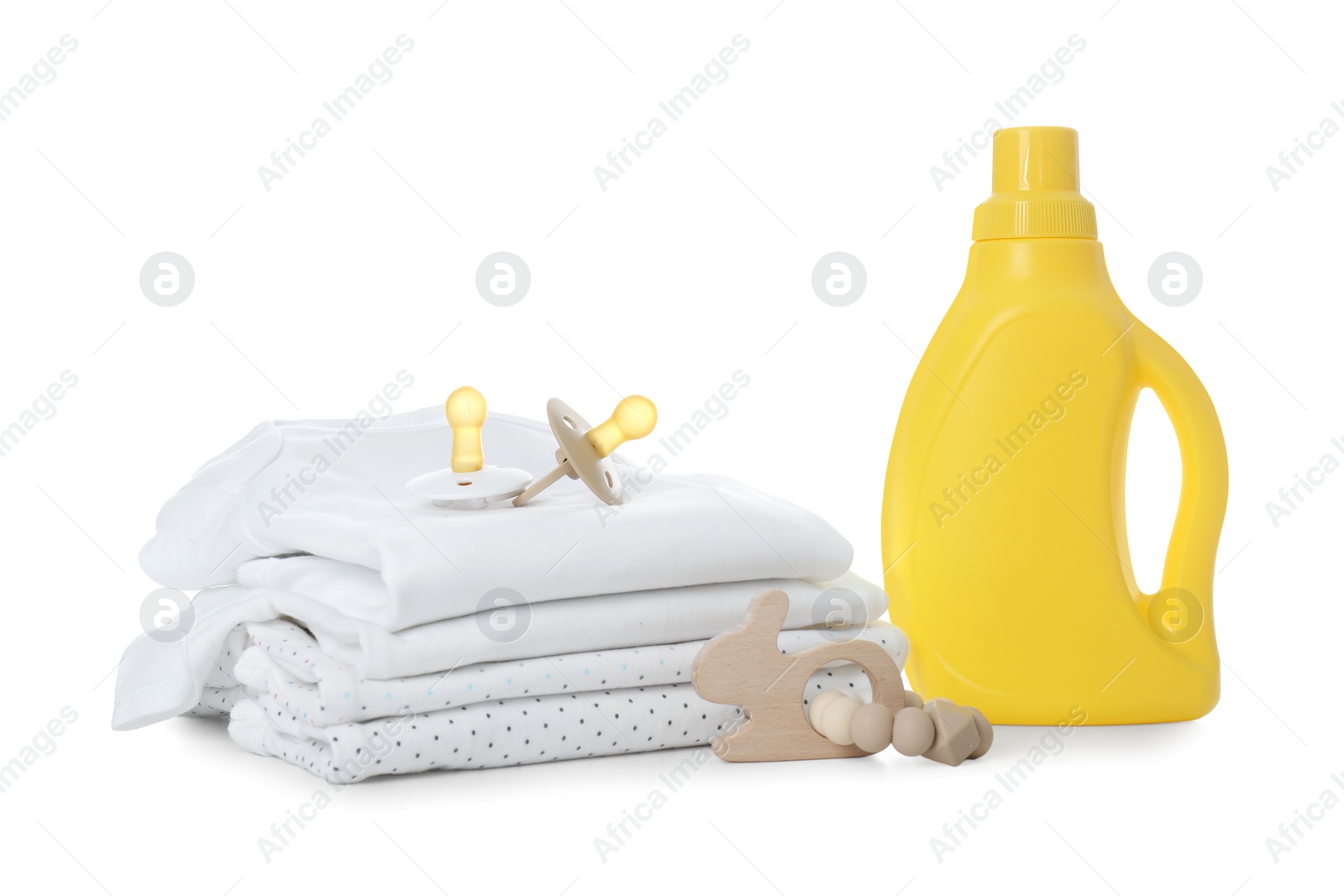 Photo of Detergent, children's clothes and pacifiers on white background