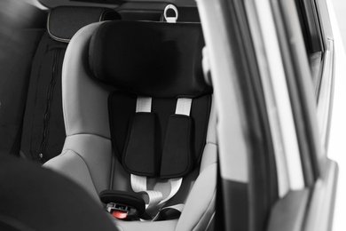 Empty baby seat inside car. Child safety