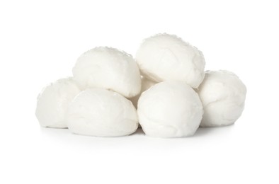 Delicious mozzarella cheese balls on white background