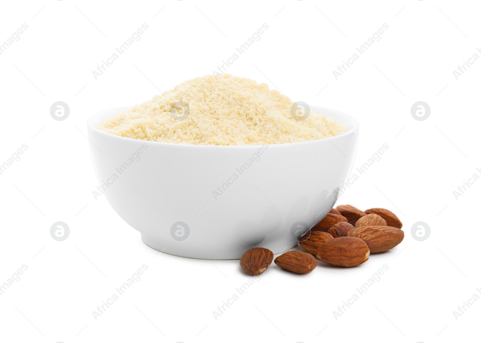 Photo of Bowl with almond flour and nuts on white background