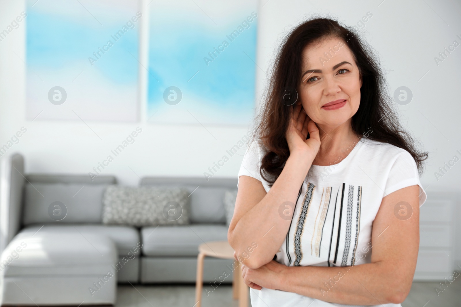 Photo of Portrait of mature woman with beautiful face indoors. Space for text