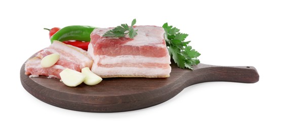 Photo of Pieces of pork fatback and different spices on white background