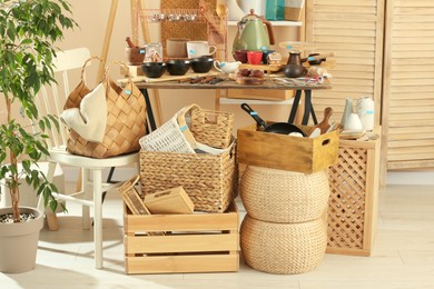 Photo of Many different cooking utensils in room. Garage sale