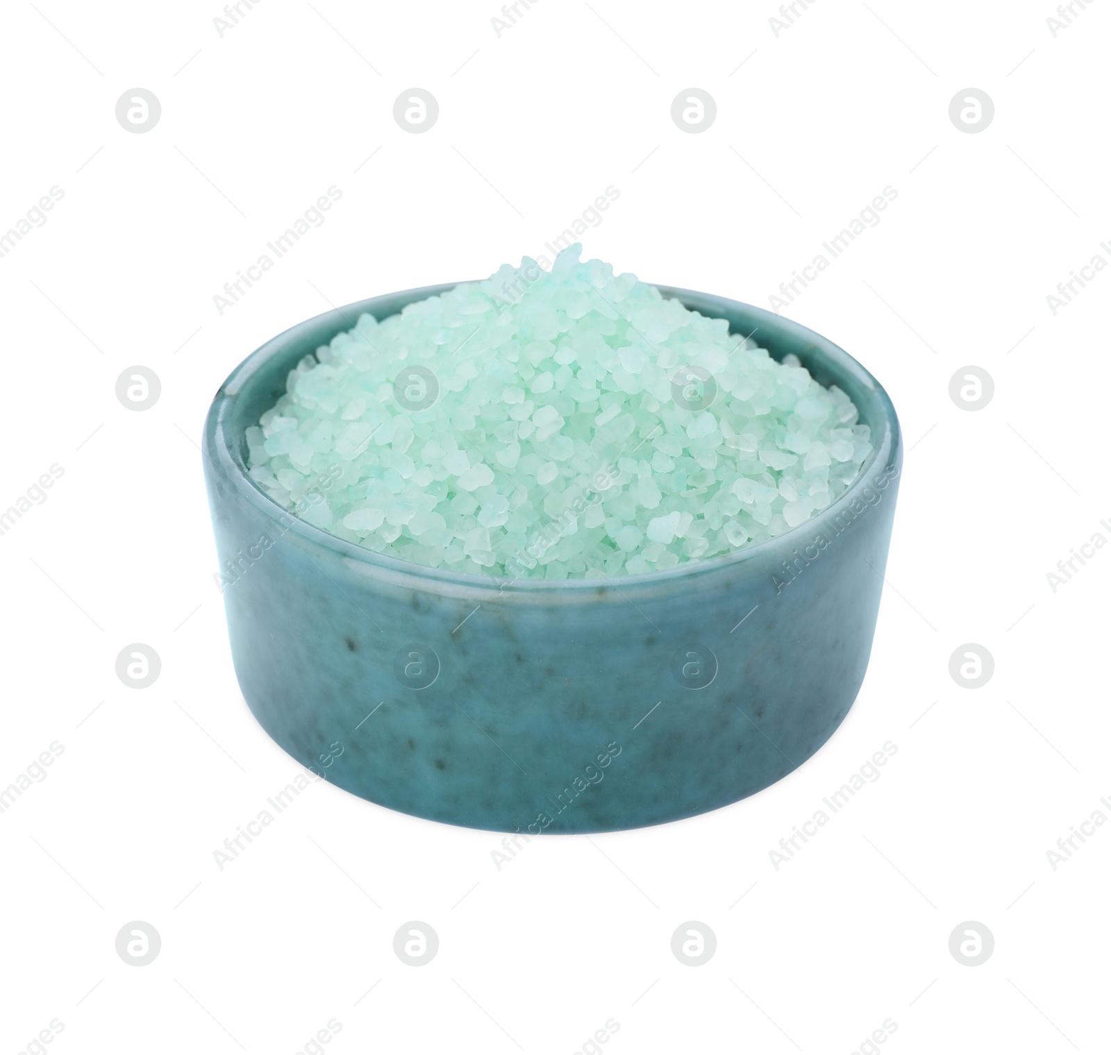 Photo of Bowl with turquoise sea salt isolated on white