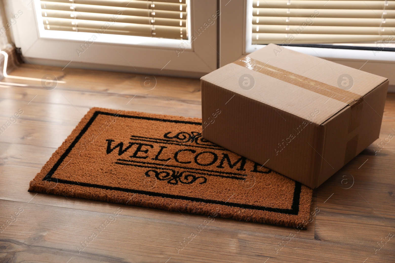 Photo of Parcel on mat near front door indoors