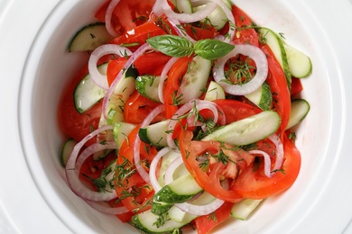 Photo of Plate with delicious fresh salad, top view