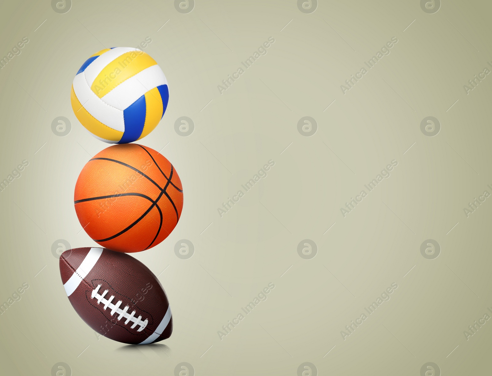 Image of Stack of different sport balls on beige background, space for text