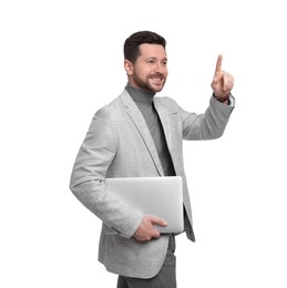 Handsome bearded businessman with tablet pointing at something on white background