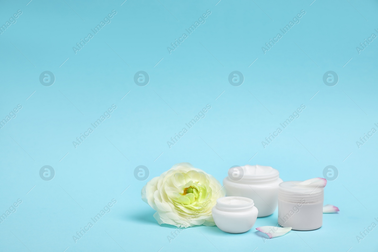 Photo of Composition with cosmetic products on color background