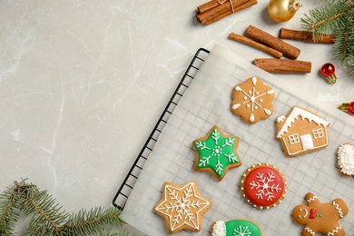 Photo of Tasty homemade Christmas cookies on parchment paper, top view